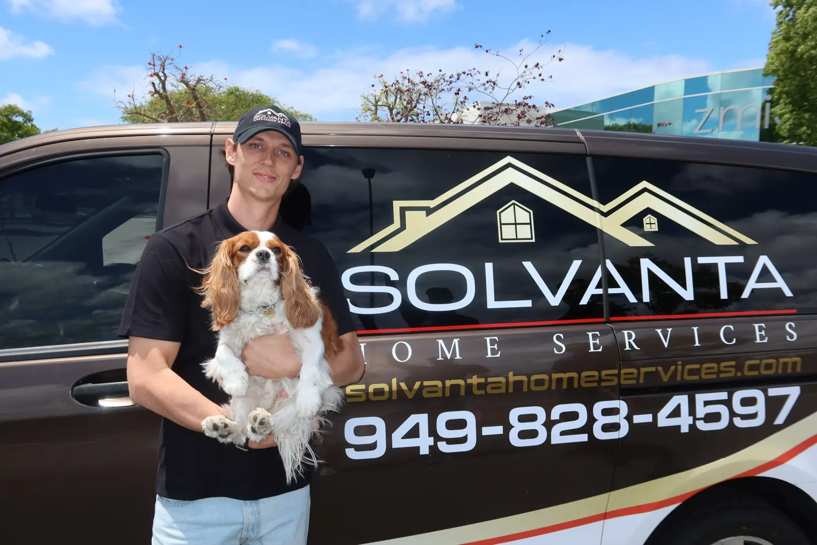 Solvanta technician with the company van and the office dog