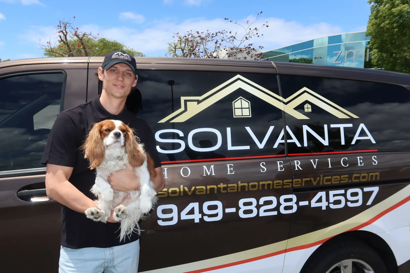 Solvanta service van with the office dog in the back